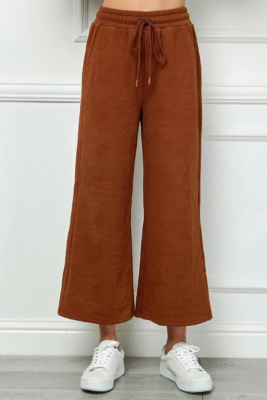 form stretch pants -Textured Cropped Wide Pant In Rust